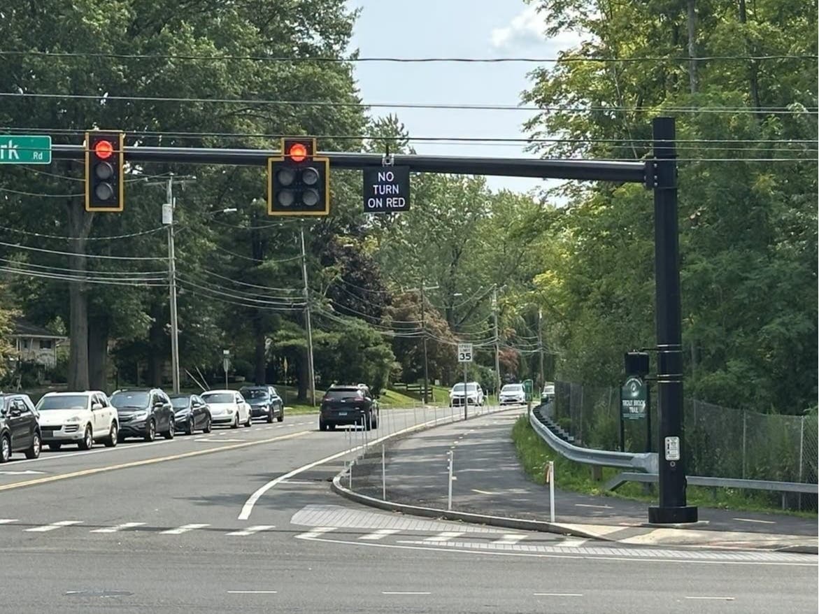 The intersection of Trout Brook Drive and Park Road now has no-turn-on-red signage installed on the southbound approach. The signs illuminate during the pedestrian crossing phase, one of many new town-wide features aimed at improving safety.