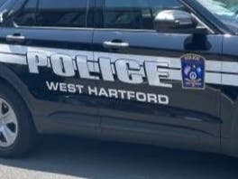 A key West Hartford roadway was closed Wednesday afternoon after an accident that involved a vehicle, a bicyclist, and a utility pole, police said.