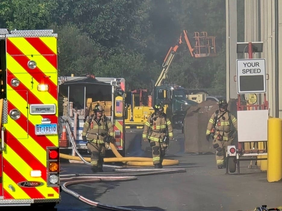 Berlin firefighters swarmed a local business Friday morning after a fire broke out underneath a conveyor belt there.