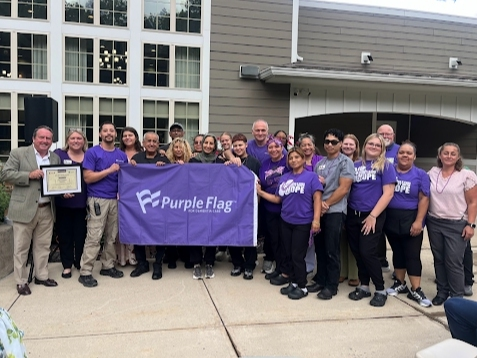 Residents and staff recently gathered to mark the renewal of Farmington Station's Purple Flag Excellence in Dementia Care accreditation.