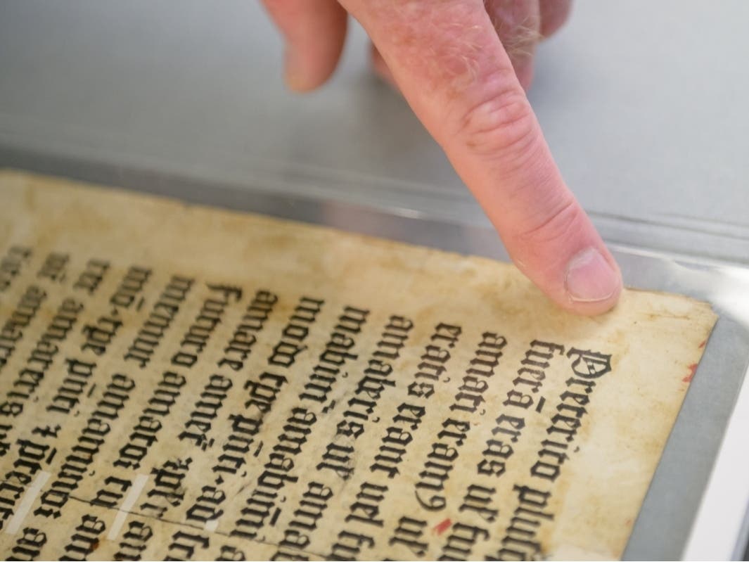 A page of text tucked inside an uncatalogued scrapbook at Trinity College for more than a century has been identified as a previously unknown example of 15th-century printing connected to associates of Johannes Gutenberg.
