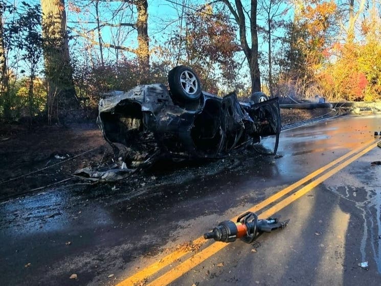 Berlin police and fire swarmed a chaotic crash scene Tuesday afternoon after a vehicle slammed a utility pole, rolled over, and caught fire.