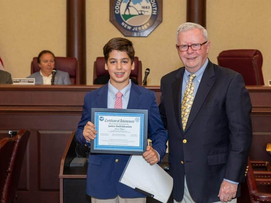 Historical Commissioner Glenn Cashion (right) presented James Badishkanian (left) from Oak Hill Academy in Middletown with the first-place award for his essay, “A Boy From Dikranagerd.” Cashion said James exhibited "outstanding" oratorical skills.   