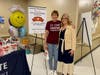 Cindy Manly (left), an Immediate Care Nursery nurse at Advocate Sherman Hospital, receives a cookie and flower from State Sen. DeWitte's team and is pictured with Susan Morby (right), Chief Nursing Officer. 