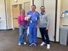 Yana Z., Mike Z. and baby Michael reunite with Dr. Michael Riermaier. 