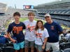 Julie Hermann with her two sons and husband at the Chicago Bears game. 
