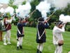 A musket fire demonstration at a Revolutionary War encampment on the grounds of the Historic Presbyterian Church.