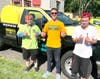 Matt Peters and his crew from Weed Man give a thumbs up to Welcome Day.
