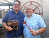 The presidential gavel of leadership is passed from Kyle Davis, left, to Mick Petrucci.