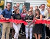Julie Haines cuts the ribbon on her new agency in Newtown Borough.