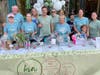 Volunteers selling chances to win gift baskets in support of the Kin Center.