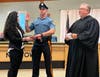 District Judge Mick Petrucci, right, swears in Edward Grinberg, Newtown Township's newest full-time police officer.