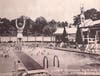 A historic photo of the original pool with diving boards is on display at the entrance to the pool.