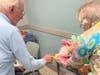 Pickering Manor residents picking out bunnies for their grandchildren.