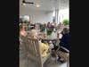 Pickering Manor Cottage & Personal Care residents enjoy conversation and a delicious meal together on the Garden Terrace of the Pickering Manor Yates Pavilion during the auxiliary-hosted ‘Resident Picnic.’