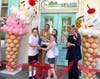 Lindsay Baker and her children cut the ribbon on Mom's Cookie Bar as Dr. Vail P. Garvin, president and CEO of the Central Bucks Chamber of Commerce, looks on.