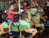Enjoying the ride on the Merry-Go-Round.