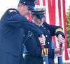 Newtown firefighters Deputy Chief 45 Liz Ellis and trustee Joe Martindell lighting a pair of twin candles in memory of the first responders who rushed into the towers to save lives.