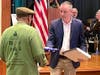 U.S. Congressman Brian Fitzpatrick presents a flag flown over the U.S. Capitol building to Rodney Wyatt and Salute 2 Service.