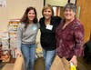More than 200 volunteers lent a hand at the food sorting and packing event held at Shir Ami Reform Synagogue of Newtown last month. From left are Melissa Riskin of Newtown; Barbara Cohen of Fort Washington; and Donna Desantis of Langhorne. 