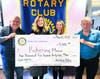 Maureen Kuhar and Rachel Carver of Pickering Manor accept a donation from Rotary Club President Mick Petrucci and Pickering Manor Golf Outing co-chair Paul Salvatore.