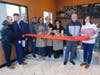 Cutting the ribbon at the new Mamie Colette.