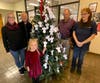 Helping to decorate the Angel Tree at the Newtown Post Office are Danielle Wittig, Rotarian Dr. Jerry Agasar, Charlotte Wittig, Angel Tree coordinator Paul Salvatore and Dawn Obeidat from the Newtown Post Office.