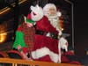 Santa arrives aboard an antique fire truck.