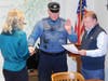 Corporal Sean Orr is sworn in by Mayor John Burke as the department's new sergeant.