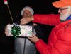 Newtown's Ron Fesmire officially lights the tree.