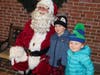 Santa listens to wishes following his arrival in Newtown Borough.