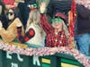 Parade Chair Tina Leck waves from aboard a Leck Waste Disposal Truck.