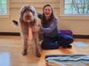 Kin Erika starting a breathing and meditation class with well dressed mascot, Sunny.