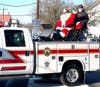 Santa waves from is sleigh carried aboard Utility 45.