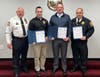 Chief Hearn, left, presents Commendations for Heroism to Detective Moffett, Detective Corporal Camp and Lieutenant Harris.