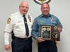 Chief Hearn presents a years of service award to Corporal Keegan.