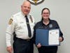 Chief Hearn presents a Commendatory Citation to Amanda Pell.