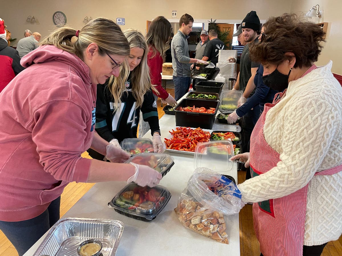 Volunteers prepare meals at the American Legion on Christmas Eve.