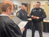 Officer William J. Moller takes the oath as his brother, Ben, holds the bible. Ben Moller is an officer with the Quakertown Borough Police Department.