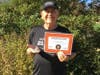 Bill Gaboda of Yardley, PA, a NO BULLying Run participant in the 70-79 age category, poses with his award certificate for logging the most miles in his age category.  