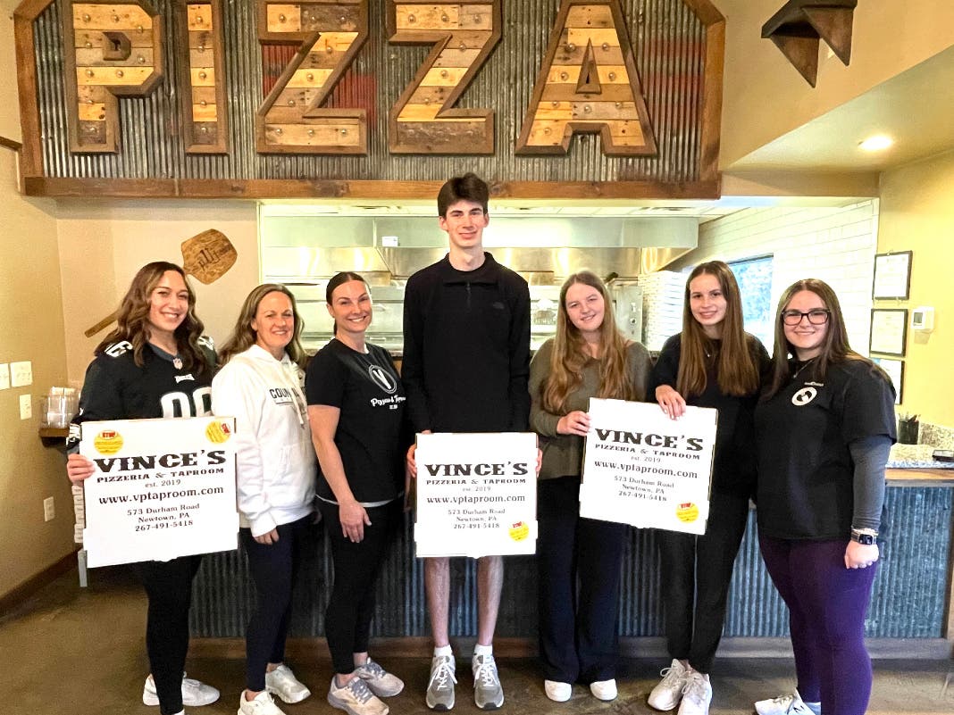 Council Rock North SADD students join leaders of TMA Bucks and the owners of Vince's Pizzeria and Taproom to raise underage drinking awareness.
