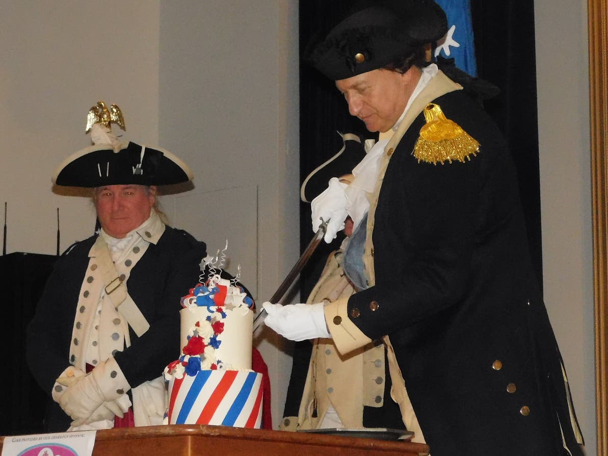 General Washington cuts his birthday cake at Washington Crossing Historic Park.