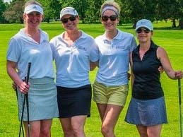 A foursome prepares at last year's Kin golf outing.