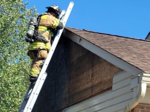 A firefighter checks for extension.