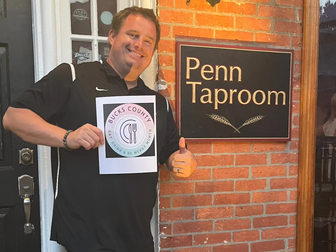 Albie, the manager at the Penn Taproom, gives a thumbs up to the event.