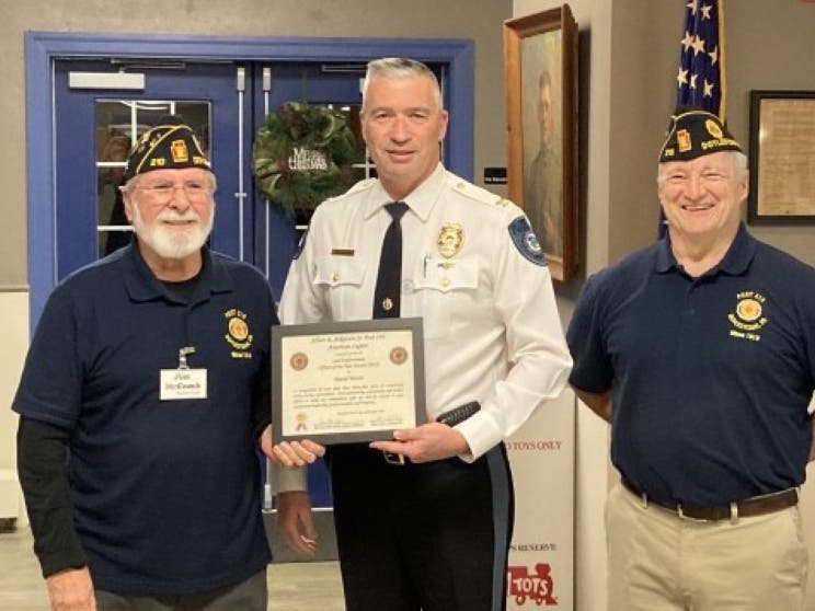 Chief David Mettin accepts the "Law Enforcement Officer of the Year" Award from the American Legion.