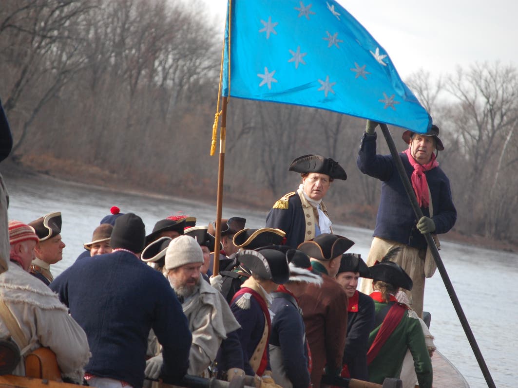George Washington portrayed by John Godzieba crosses the Delaware River during 'The Crossing.'