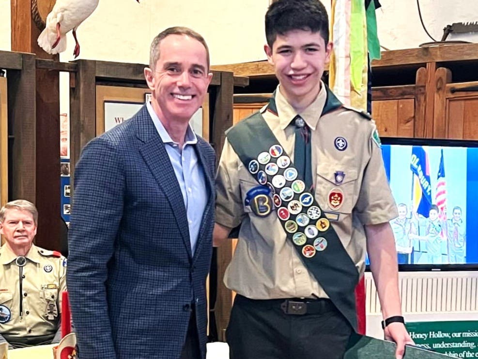 State Senator Steve Santarsiero congratulates Reed Finch on achieving Scouting's highest award.