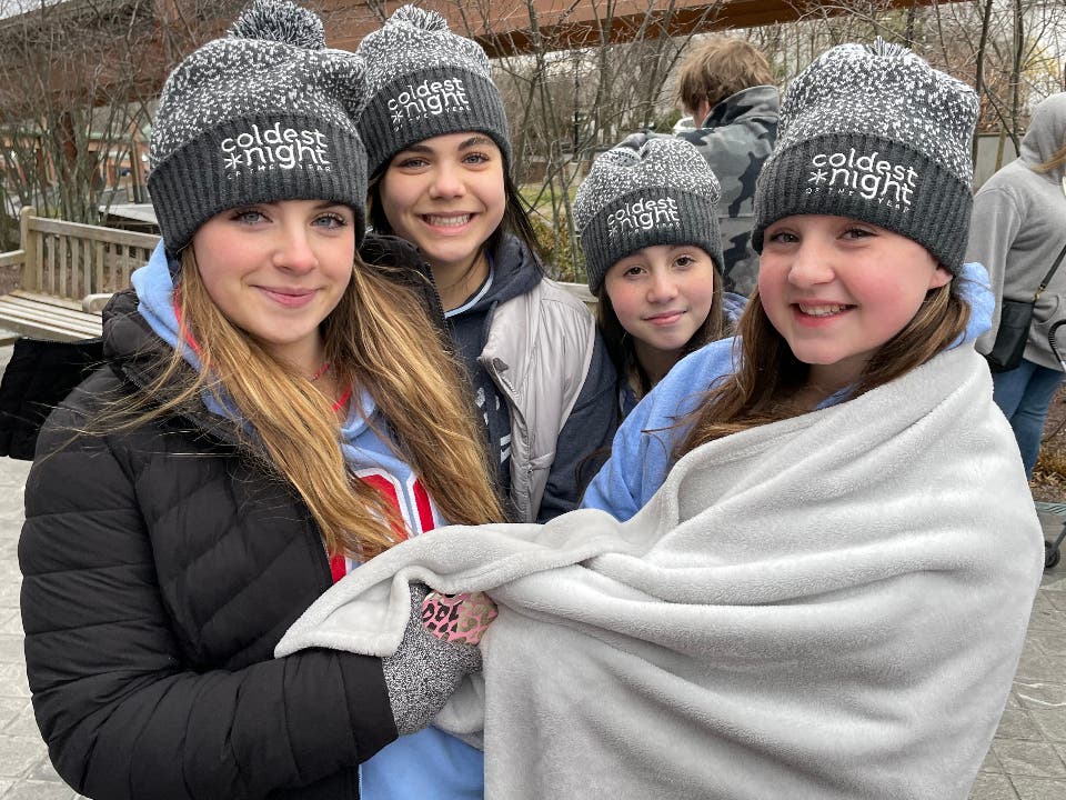 A group of friends is bundled up against the cold during last year's walk.