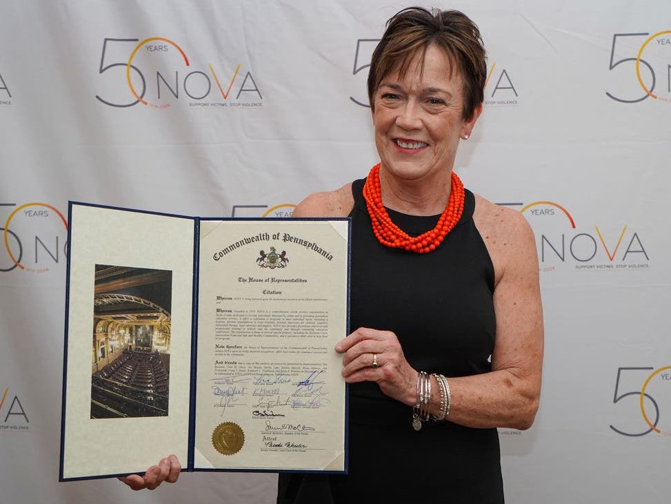 Penny Ettinger, executive director of NOVA, with a proclamation from state legislators commemorating NOVA’s 50 years of service to Bucks County.